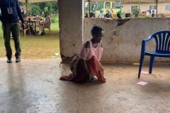 One recipient kneeling as they make their way across the floor
