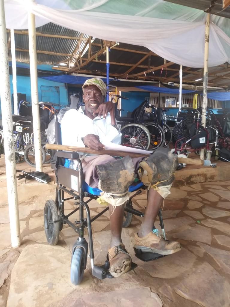 The man from the previous picture sat in his new wheelchair