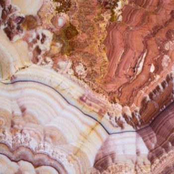 An abstrct photo of rock frmations in different shades of pink