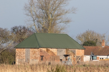 Barn conversion project, Renovation of farm building in progress. Rural brick built barn outbuilding being converted.