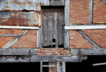 Dilapidated barn facade.