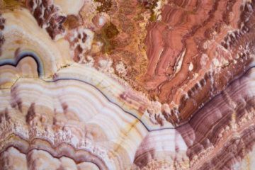 An abstrct photo of rock frmations in different shades of pink