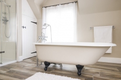 Bath tub in a modern luxury bathroom interior.