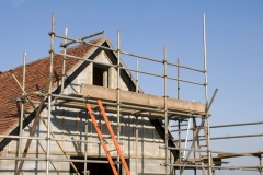 Scaffolding around a new house in the countryside