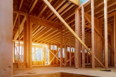 Interior view of a house under construction home framing
