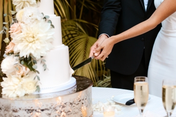 Three tiered white wedding cake