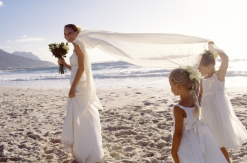 Bride and bridesmaids on the beach
